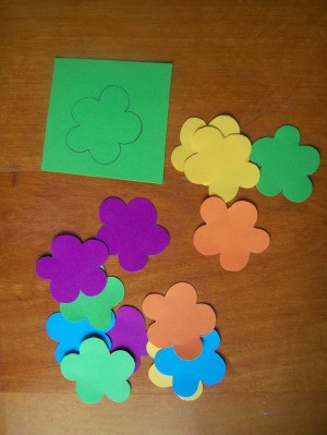 Trace and cut flowers from differnt colored paper.