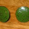 Two vintage buttons.