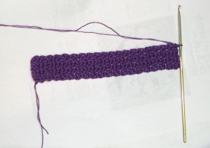 Purple rectangle section of bracelet.