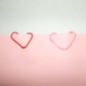 Turn Your Paper Clips Into Hearts by bending them.