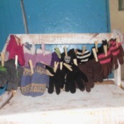 Hang Mittens In Pairs, on string or twine.