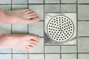 Feet near shower drain