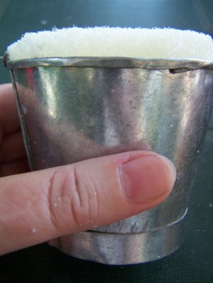 Galvanized bucket with foam insert.