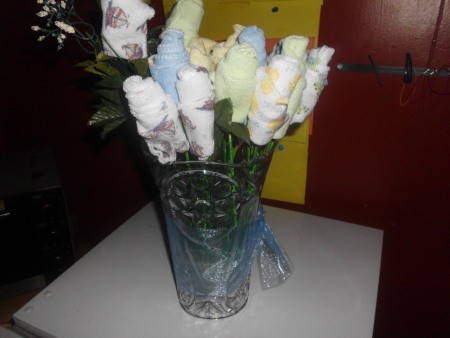 Vase of washcloth flowers.