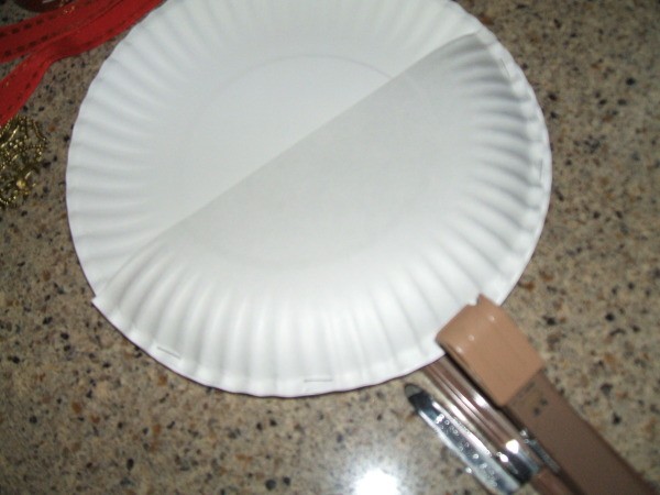 Stapling the half plate to the whole one.