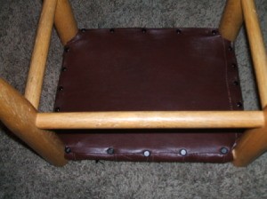 Leather Jacket Footstool - Covering the center of the underside with the final piece of leather.