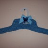 Blue crocheted clothes hanger.