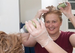 A woman dying her hair
