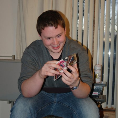 Young Man looking at his Comic Book Wallet