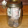 Saving money in a jar.