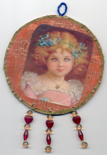 A Christmas ornament made from a recycled CD.