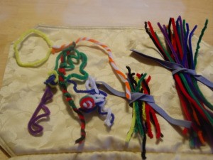 Pipe Cleaner Play Case - Stored pipe cleaners and some used for crafting shapes.