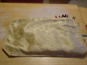 Pipe Cleaner Play Case - Mats folded in half with pipe cleaners inside.