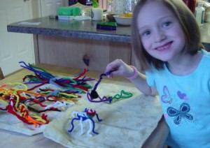 Pipe Cleaner Play Case - Child building pipe cleaner bugs, etc.
