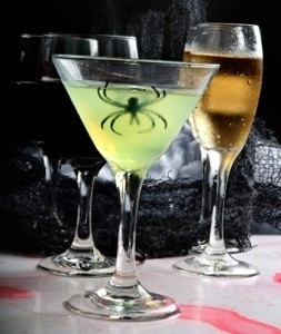 A glowing drink with a spider inside it.