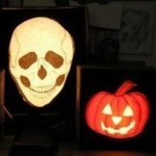 Two pumpkin and one skull light.