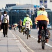 Several people commuting by bike.