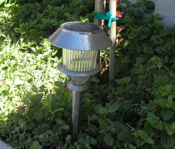 Attach Solar Lights to Your Fence - Solar light stuck in the ground.