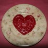 Recycled Candle Wax Air Freshener - Heart shaped wax freshener cooling on a plate.