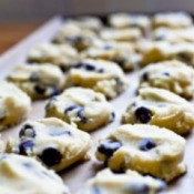 Chocolate chip cookie dough on baking sheet.