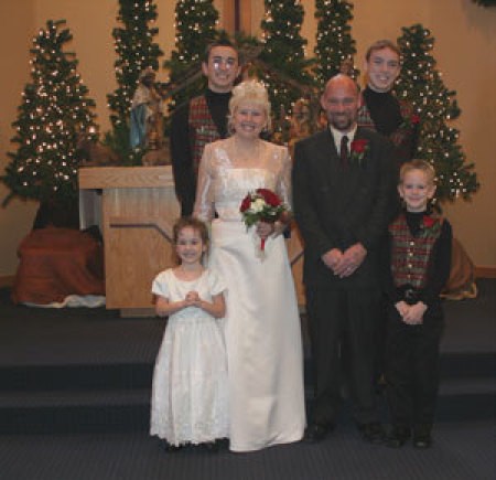 Wedding inside a church decorated for Christmas.