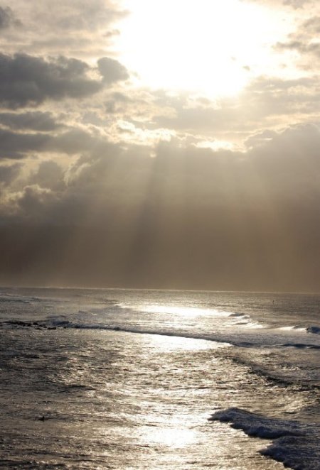 Scenery: Ocean (Maui, Hawaii) - waves with the sun shining through the clouds.