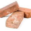 Photo of three red bricks.