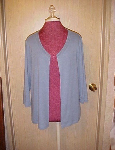 A sweater that has been converted into a cardigan.