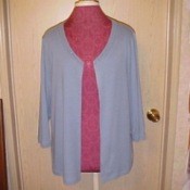 A sweater that has been converted into a cardigan.