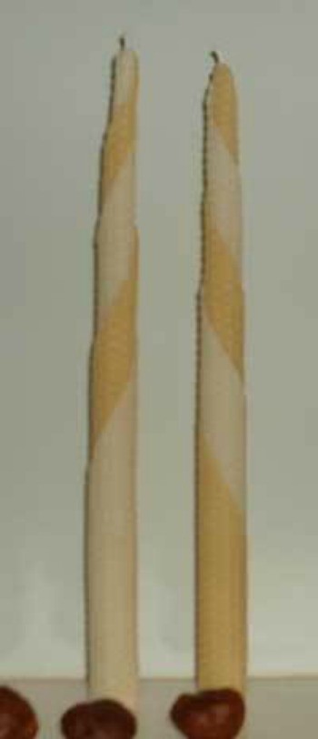Beeswax candles in a tapered shape.