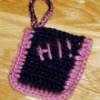 A crocheted cell phone carrier.