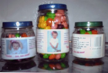 Baby food jars filled with candy as a favor.