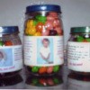Baby food jars filled with candy as a favor.