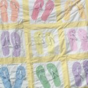 A quilt made with a flip flop pattern.