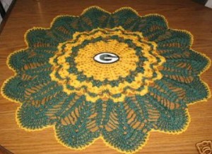 A doily in yellow and green with a G for Green Bay Packers.