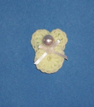 Small angel with bead for head.