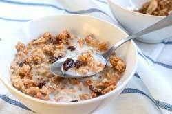 A bowl of granola with milk.
