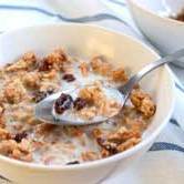 A bowl of granola with milk.