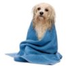 Wet dog wrapped in a blue towel.