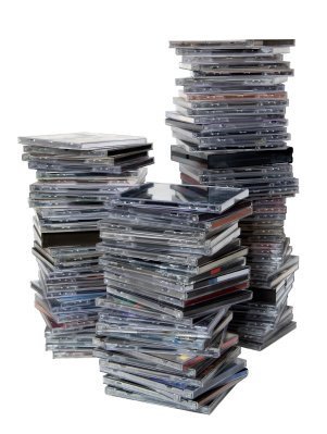 Three large stacks of CD Jewel Cases.