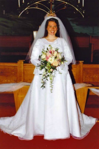 Bride wearing a wedding dress.
