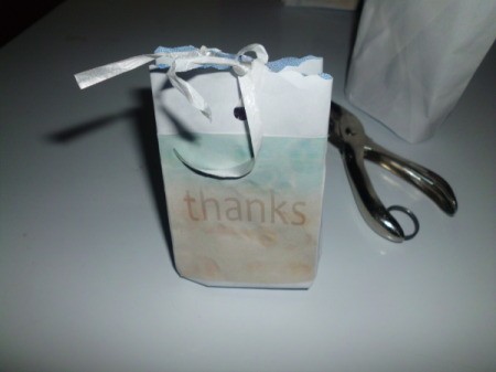 decorated white envelop bag tied with ribbon