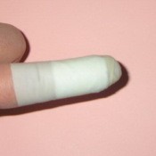 Use Rubber Glove Finger To Protect Bandages - before tape