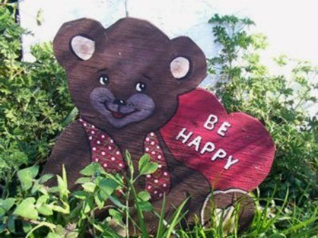 Bear with a heart sign Be Happy.