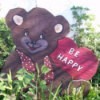 Bear with a heart sign Be Happy.