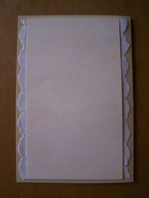 Glue marbled tan-colored cardboard to front center of card.