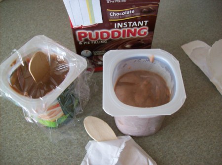 Cups of pudding and yogurt.