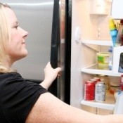 Woman opening the refrigerator.