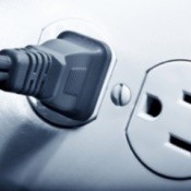 An electric plug in an outlet.