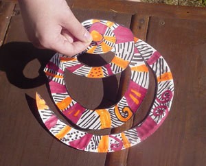 A spiral twirler for decoration, made from a paper plate.